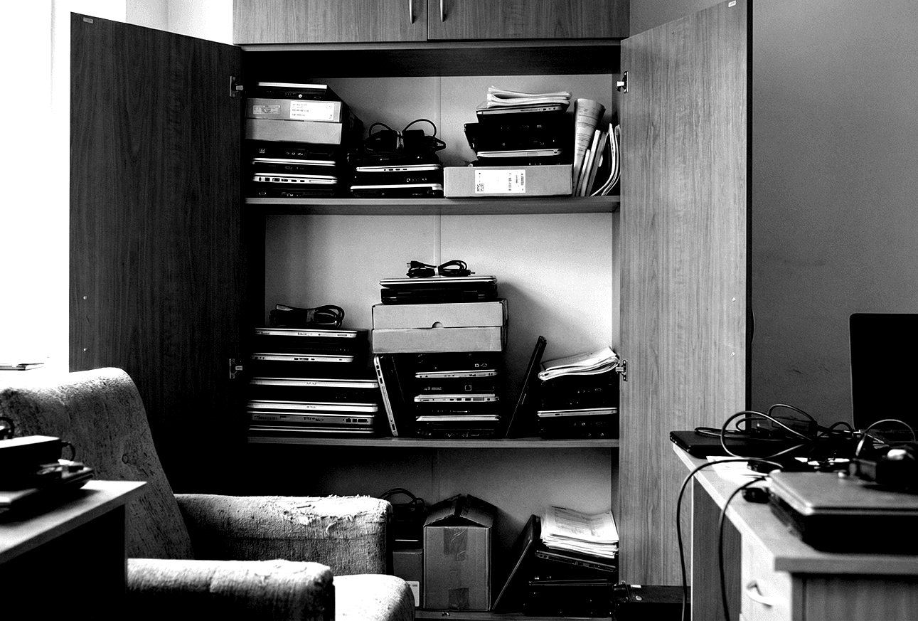 Stacks of laptops ready for trade inside a Koramangala office